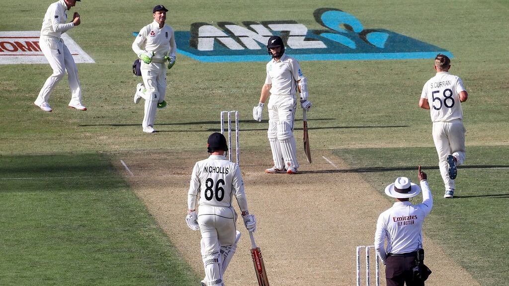 England’s Sam Curran celebrates as teammate Ben Stokes takes a catch to dismiss New Zealand’s captain Kane Williamson during the second day of the first Test at Bay Oval in Mount Maunganui. Photo: David Gray/Getty Images