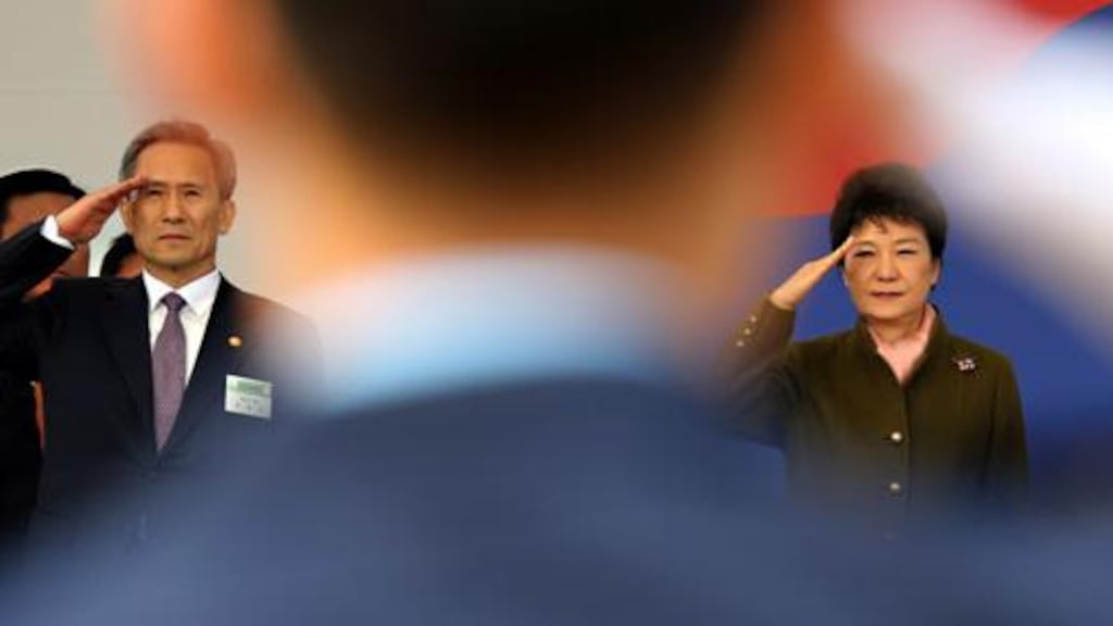 South Korean president Park Geun-hye and defence minister Kim Kwan-jin salute at a ceremony for 5,780 military officers in Gyeryong today. South Korea is most at risk from North?s artillery and rockets. Photograph: Ahn Jeong-won/Yonhap/Reuters
