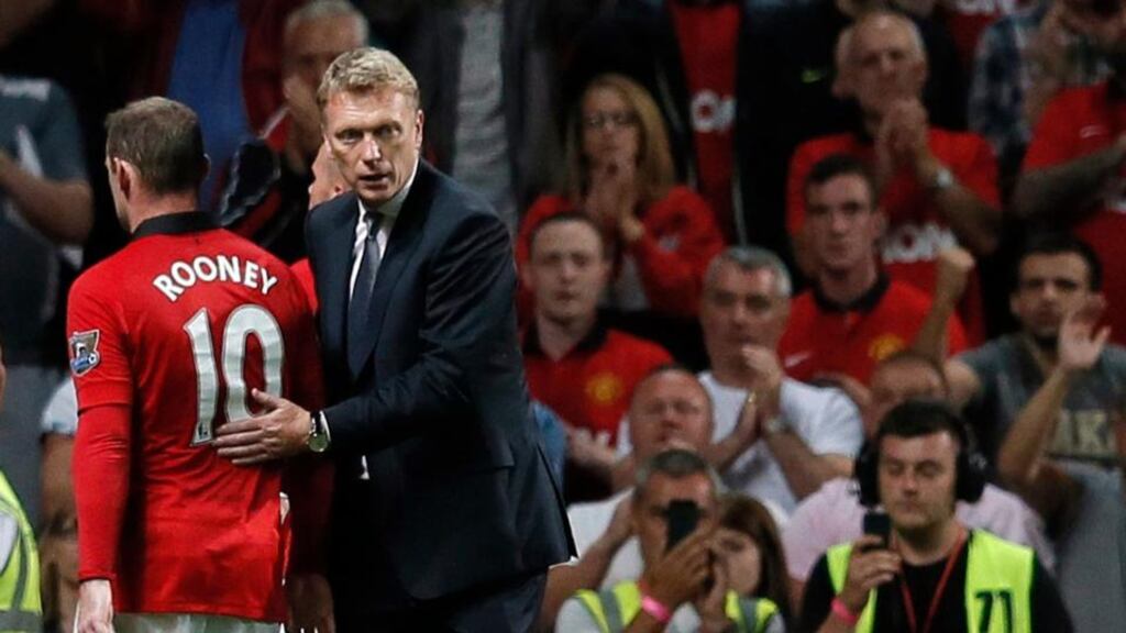 Manchester United manager David Moyes and striker Wayne Rooney after their Premier League draw with Chelsea. Photograph: Phil Noble/Reuters