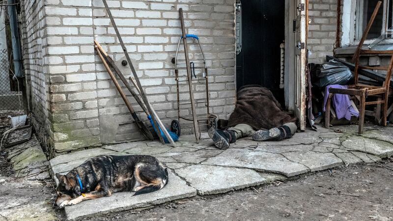 The body of a retired teacher, known as Auntie Lyuda, who was killed on March 5th at her front door in Bucha. The photograph was taken on April 6th. Photograph: Daniel Berehulak/New York Times