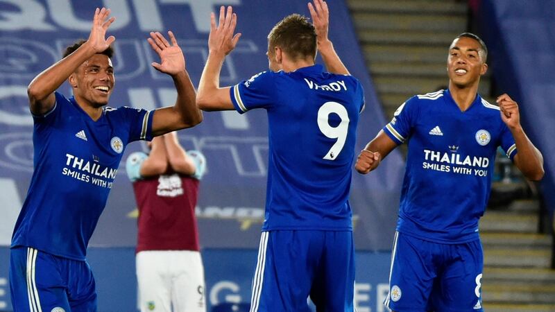 James Justin celebrates with Jamie Vardy after scoring Leicester’s third against Burnley. Photograph: Rui Vieira/EPA