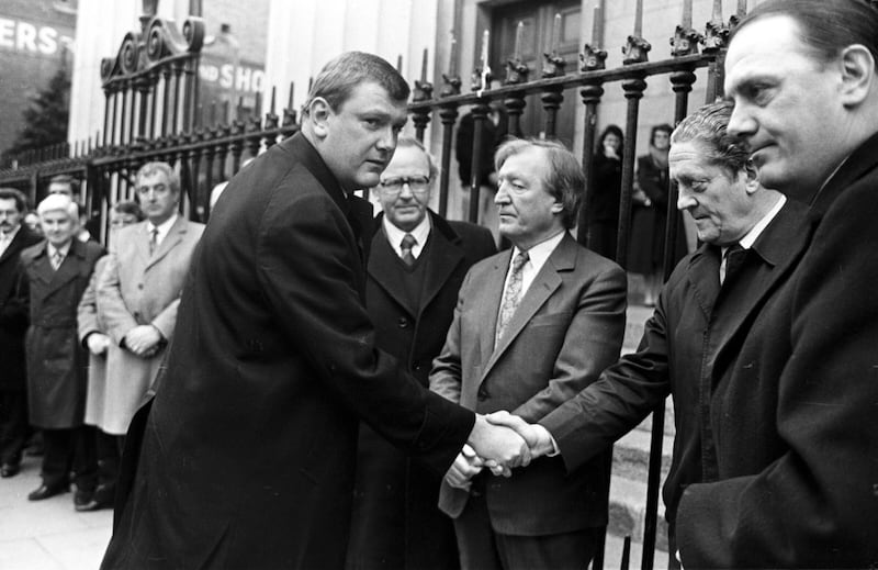 Ben Dunne shaking hands with Brian Lenihan while Charles Haughey looks on in 1986. Photograph: Eamonn Farrell/RollingNews.ie
