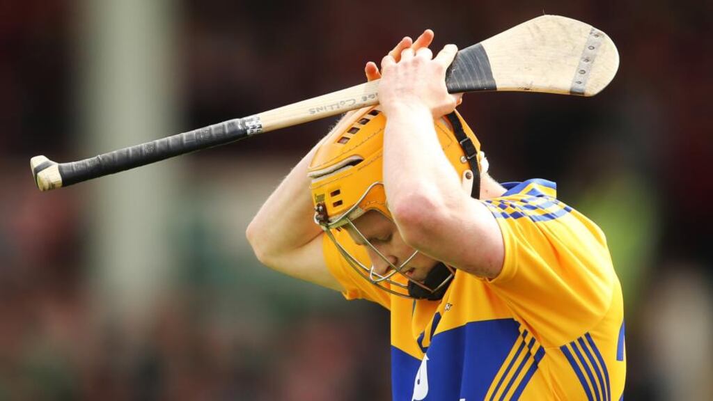 Clare’s Pádraic Collins reacts after missing one of his side’s  goal scoring chance against Cork. The misses cost them the game. Photograph: Cathal Noonan/Inpho
