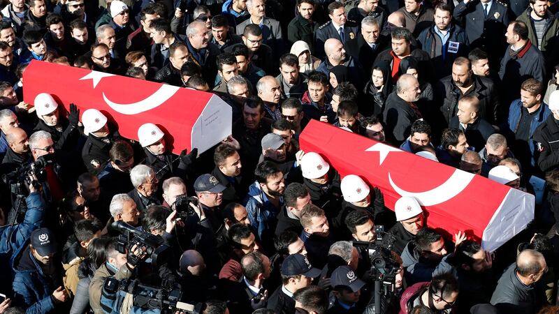 People carry the coffins of police officers killed in Saturday’s bomb attacks in Istanbul. Photograph: Sedat Suna/EPA