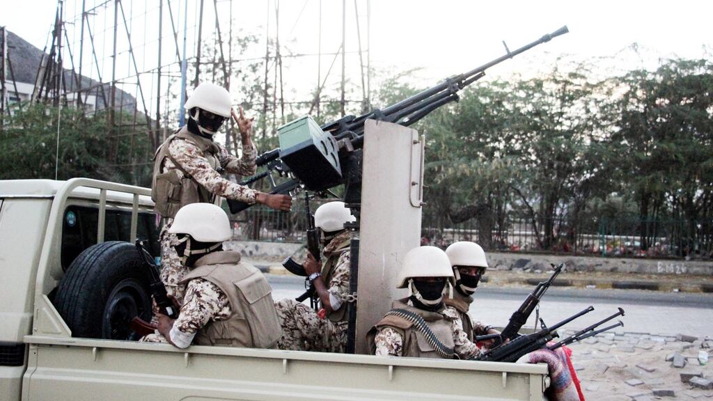 Armed supporters of the separatist Southern Movement patrol a street following clashes in the southern port city of Aden on Sunday. Photograph: EPA