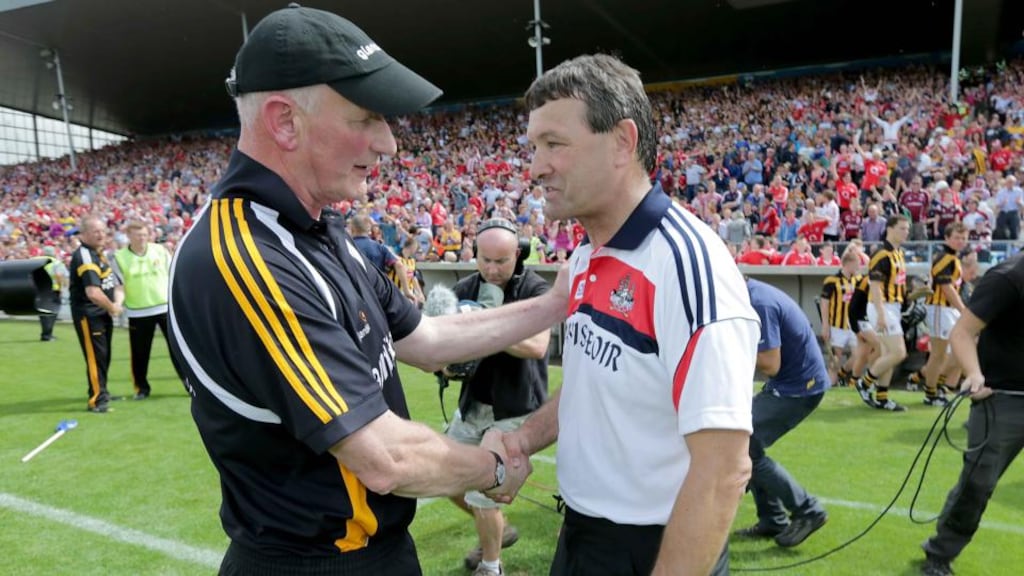 Kilkenny manager Brian Cody congratulates Cork’s Jimmy Barry Murphy after the game. Photograph: Morgan Treacy/Inpho