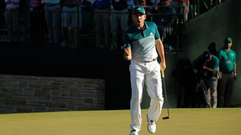 Garcia punches the air after holing his eagle putt at the 15th. Photo: Jonathan Ernst/Reuters