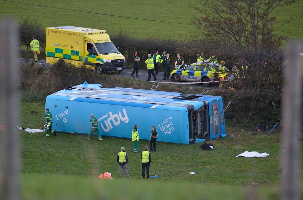 Emergency workers at the scene of the school bus crash in Co Down on Monday. Photograph: Mark Marlow/PA