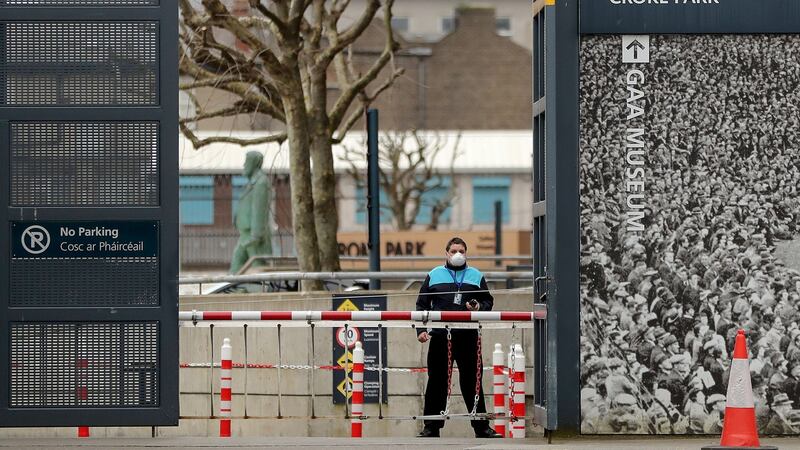 A security guard outside Croke Park when it was first used as drive-through test centre for Covid-19. Photograph: Bryan Keane/Inpho