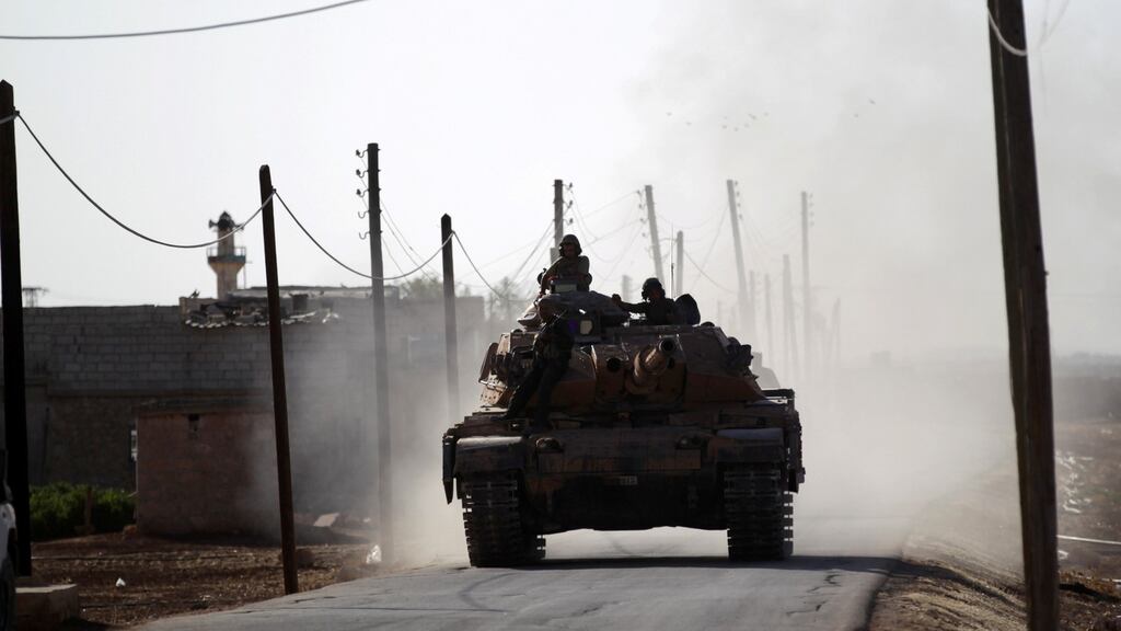 A Turkish tank drives near Guzhe village, northern Aleppo countryside, Syria October 17th, 2016. Photograph: Khalil Ashawi/ Reuters
