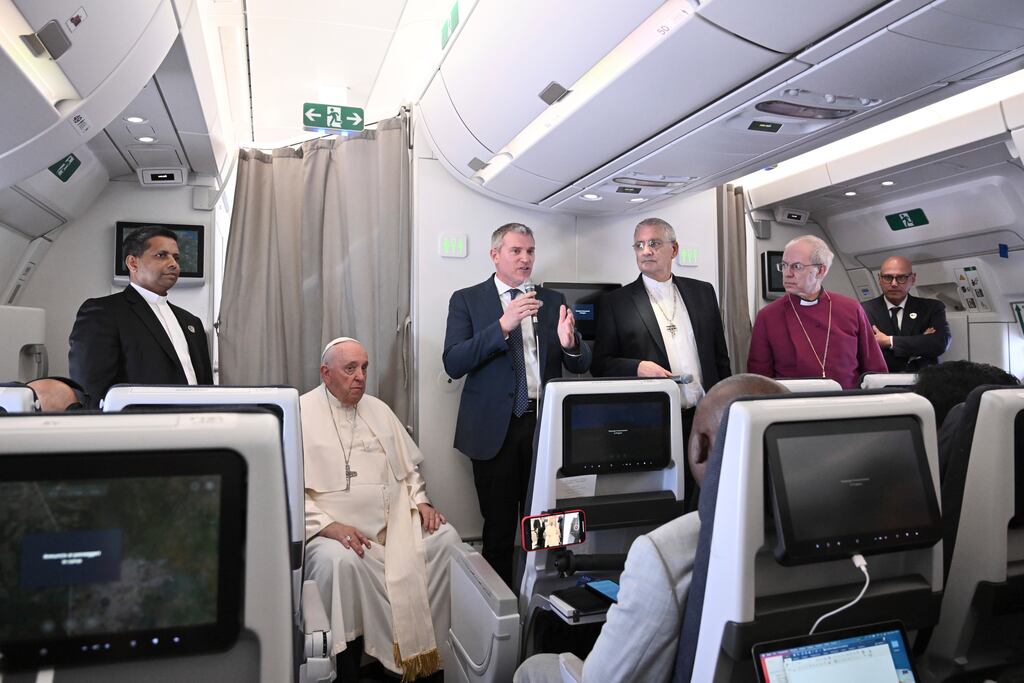 Pope Francis, Moderator of the General Assembly of the Church of Scotland the Rt Rev Iain Greenshields (fourth from left) and Archbishop of Canterbury Justin Welby (second right) meet journalists during an airborne press conference aboard the papal aircraft headed to Rome at the end of the pope's pastoral visit to Congo and South Sudan. Photograph: Tiziana Fabi/AP