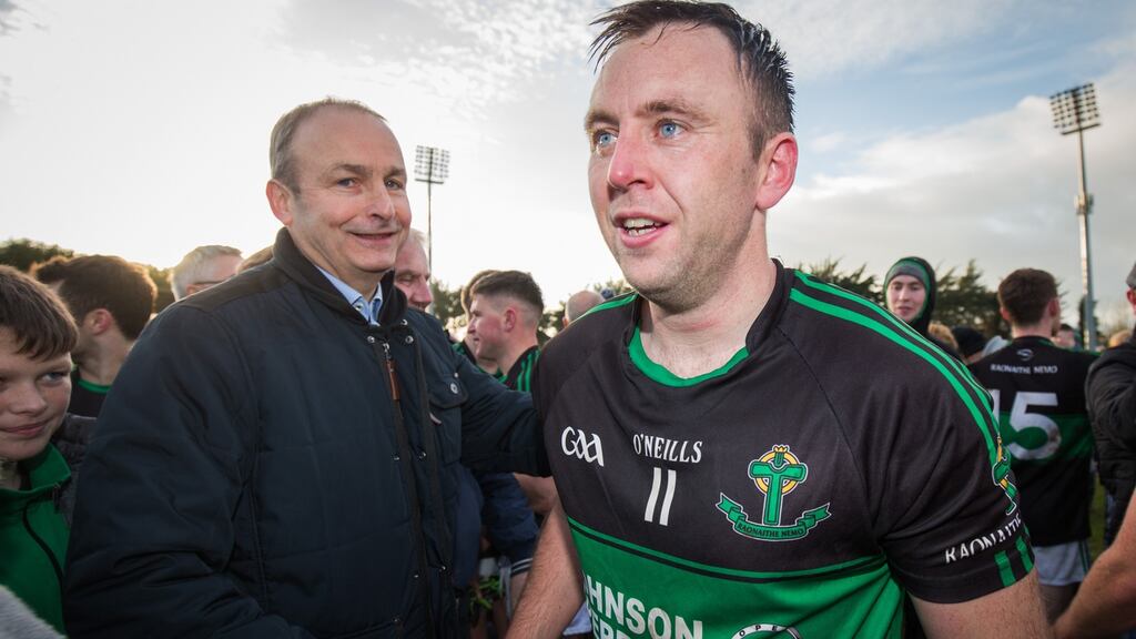 Nemo Rangers star Paul Kerrigan shakes hands with Fianna Fáil leader Micheál Martin TD following the Cork club’s side’s win over Dr Crokes in the Munster final. Photograph: Oisín Keniry