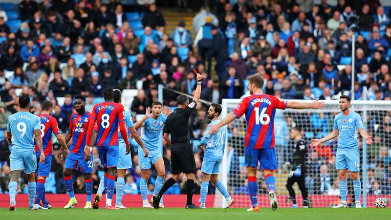 Andre Marriner shows Aymeric Laporte a red card. Photo: Alex Livesey/Getty Images