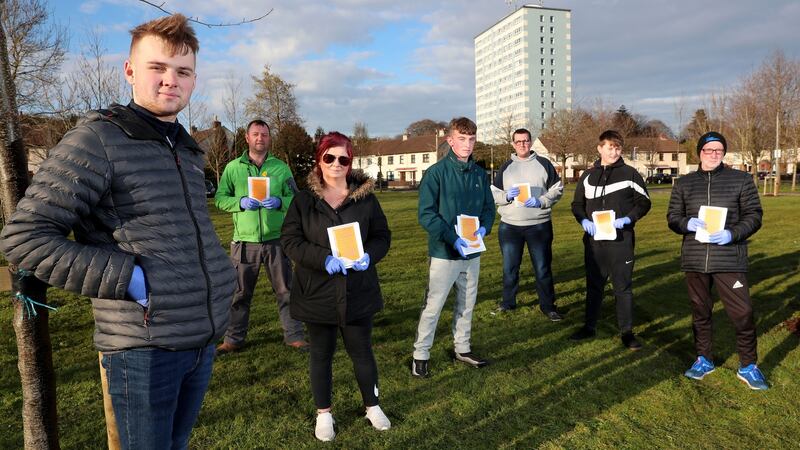 From left, Gareth Wright, and fellow members William Parke, Jennie Rice, Ross Woods, Phil Francey, Ernie Rikauskas and Philip Fitzpatrick of the Ardcarn Local Residents’ Group in east Belfast before doing a leaflet drop about coronvirus precautions in the estate. Photograph: Stephen Davison