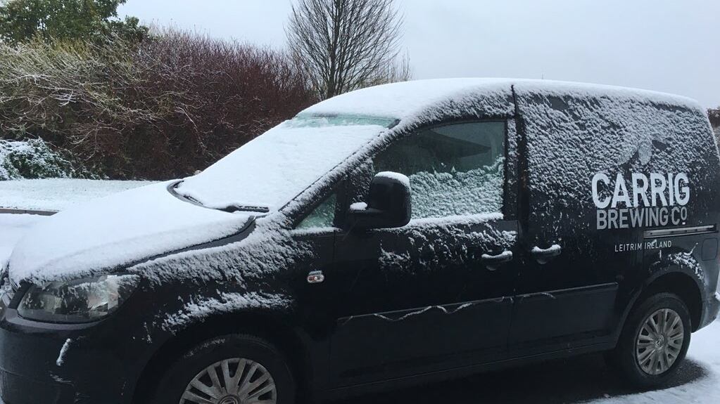 A snow-covered car in Co Leitrim on Saturday morning.   Photograph: CarrigBrewingCompany via Twitter