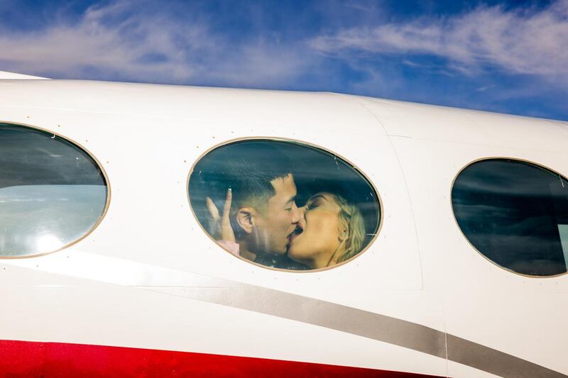 Brandon Nguyen kisses his wife Katherin before their takeoff on a Love Cloud flight to celebrate her birthday. Photograph: Roger Kisby/The New York Times