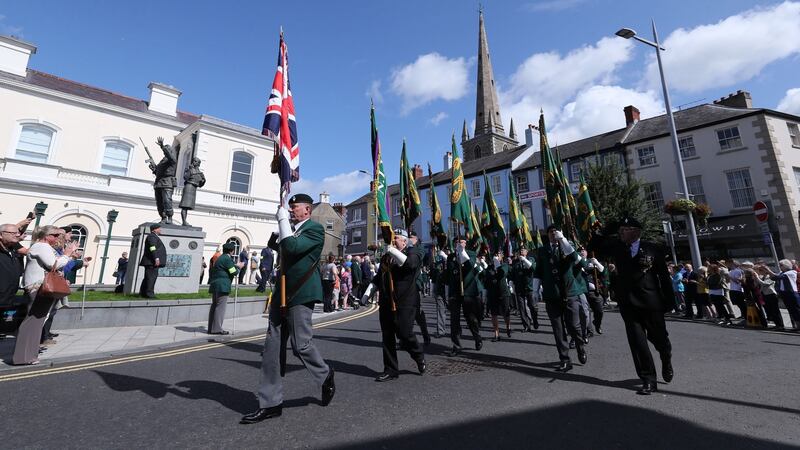 Veterans pass by the Ulster Defence Regiment memorial in Lisburn, during a Northern Ireland Veterans Association event to mark the 50th anniversary of Operation Banner. Photograph: Niall Carson/PA Wire