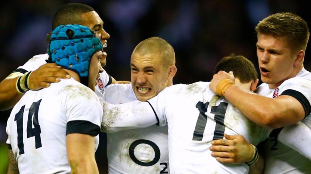 England’s Mike Brown (centre) celebrates with teammates after defeating Ireland at Twickenham. Photograph: Eddie Keogh/Reuters