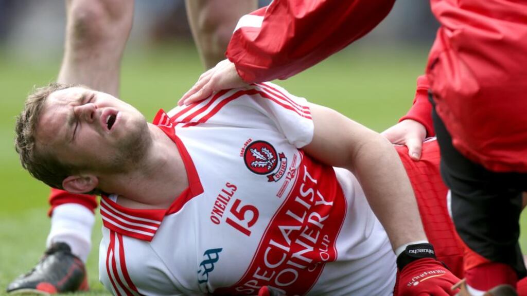 Derry’s Raymond Wilkinson lies injured during his side’s Division Two win over Westmeath. Photograph: Ryan Byrne/Inpho