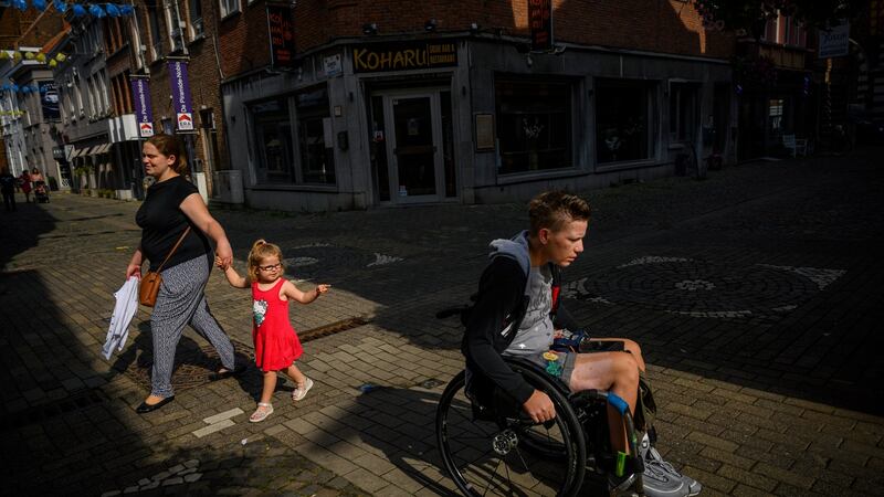 Marieke Vervoort wheels through her hometown of Diest, Belgium in the months before her death. Photograph: Lynsey Addario/New York Times