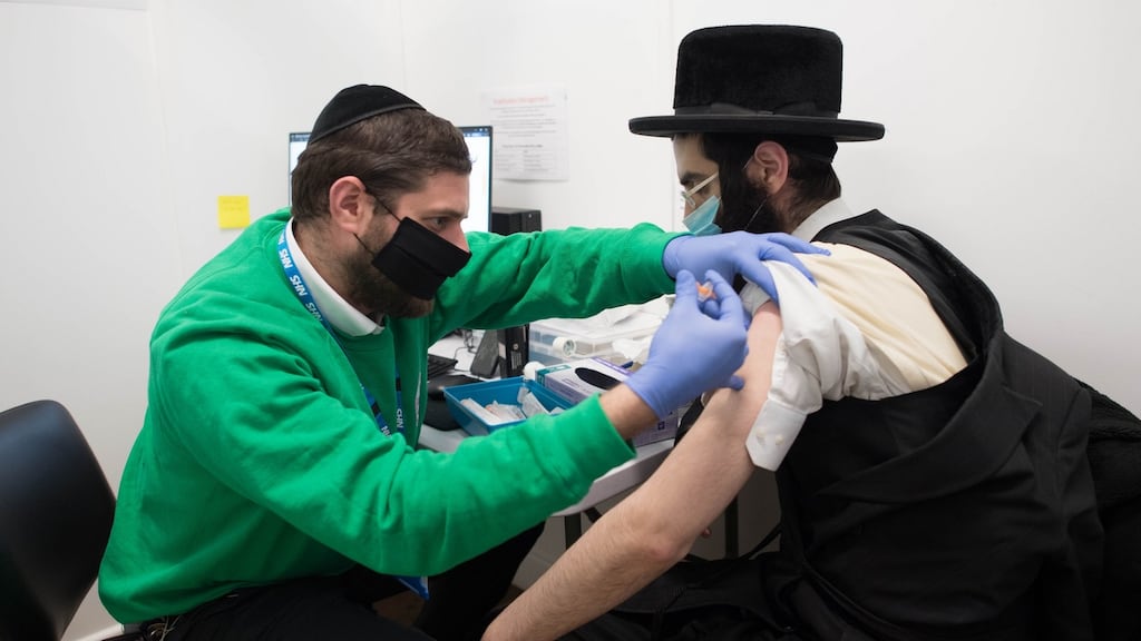 A man receives a Covid-19 vaccination on Sunday at a coronavirus vaccine clinic in Green Lanes, north London, for the local Orthodox Jewish community. Photograph: Stefan Rousseau/PA Wire
