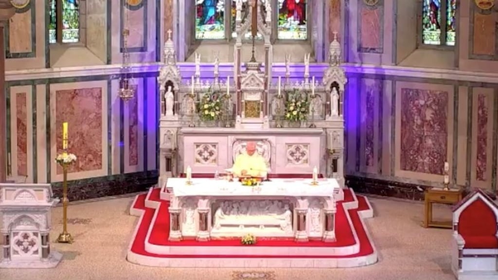 Fr Jimmy McPhillips is   seen operating a mobile device to play the final tune but instead of a hymn or some other piece of music we hear the familiar opening bars of The Sash.