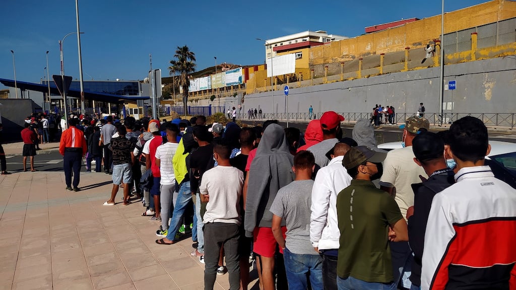 Moroccan migrants wait in a long queue at Tarajal border crossing in Ceuta, Spanish enclave in northern Africa. Most of the asylum seekers entered Ceuta on May 17th/18th when some 10,000 people managed to reach Spanish territory. Photograph: Reduan Dris/EPA