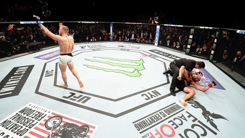Conor McGregor celebrates his knockout victory over Eddie Alvarez in their lightweight championship bout during the UFC 205 event at Madison Square Garden in New York City. Photo: Jeff Bottari/Getty Images