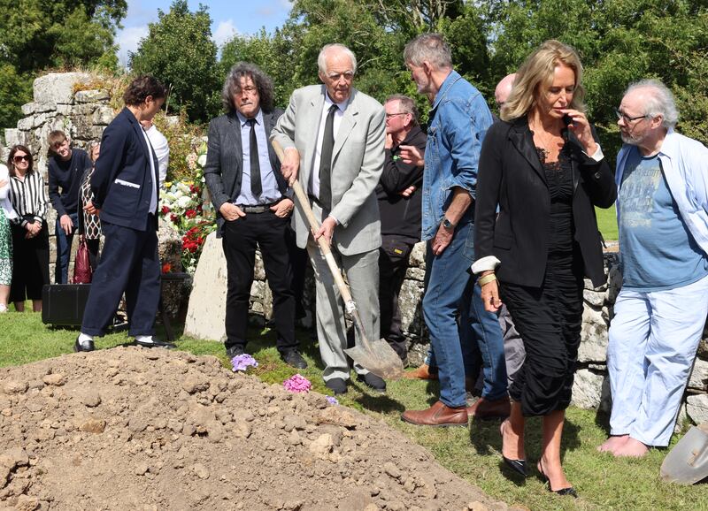 Caroline Michel (right), O'Brien's publisher with Faber, Tim Rice (centre) and actor Stephen Rea, at the burial. Photograph: Dara Mac Dónaill/The Irish Times