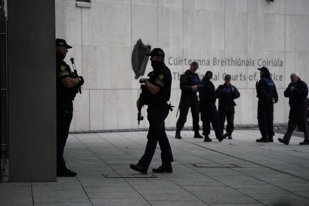 Armed officers outside the Special Criminal Court where Gerard Hutch and others appeared in connection with the murder of David Byrne at the Regency Hotel in Dublin in 2016. Photograph: Niall Carson/PA