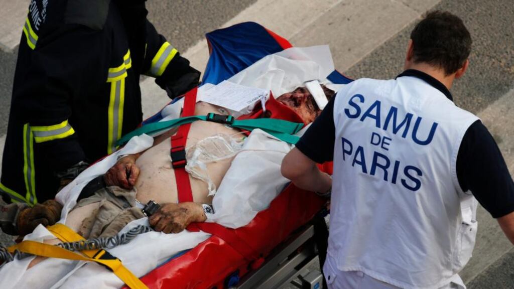A fireman and a rescue worker evacuate an injured man after an intercity train accident at the Bretigny-sur-Orge train station near Paris this evening. Photograph: Benoit Tessier/Reuters