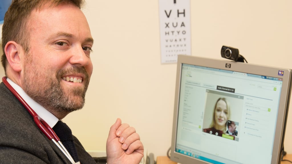 Dr Darach Ó Ciardha, Jobstown family practice, Tallaght, Dublin with (on screen) Mary O’Brien, co-founder and chief executive, of VideoDoc at the official launch of online video consultations for patients in Tallaght, Dublin