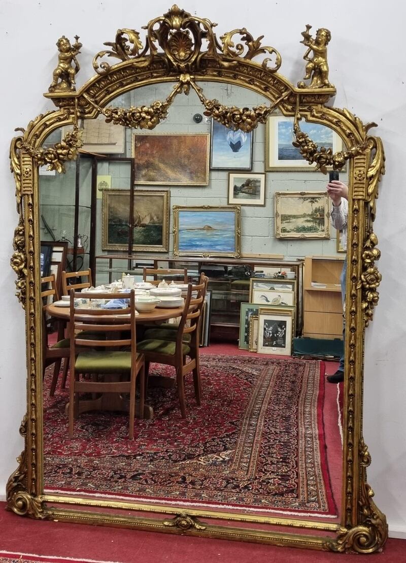 Timber and plaster gilt overmantle mirror with highly moulded outline €1,800-€2,500