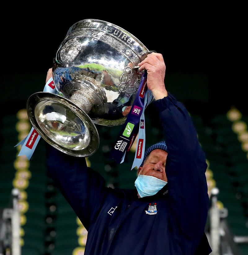 Dublin selector Shane O'Hanlon lifts the Sam Maguire after the All-Ireland final in 2020. Photograph: Ryan Byrne/Inpho