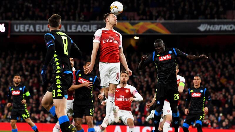 Aaron Ramsey challenges for the the ball with Napoli’s Kalidou Koulibaly. Photograph: Neil Hall/EPA