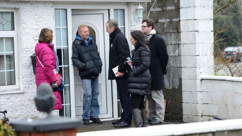 Fianna Fáil leader Micheál Martin chatting with Tommy Keating, canvassing in at Milltown Estate, Ashbourne, Co Meath, for the Meath East byelection. Photographer: Dara Mac Dónaill
