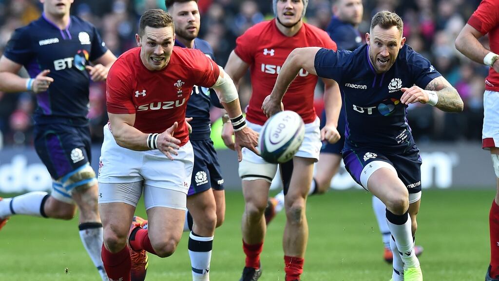 Wales wing George North and Scotland’s Byron McGuigan chase the ball during the Six Nations match at Murrayfield Stadium in Edinburgh. Photograph: Andy Buchanan/AFP/Getty Images