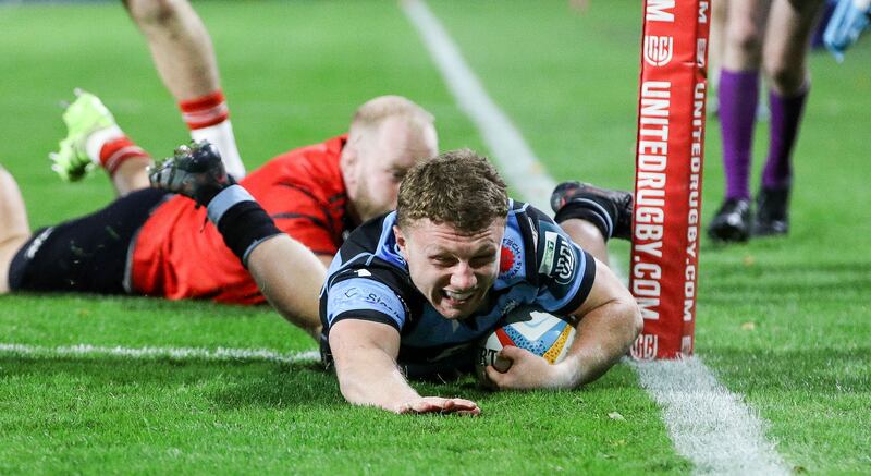 Cardiff Rugby's Tom Bowen scores a try despite Jeremy Loughman of Munster. Photograph: Nick Elliott/Inpho