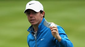 McIlroy rises to the challenge at rainy Wentworth