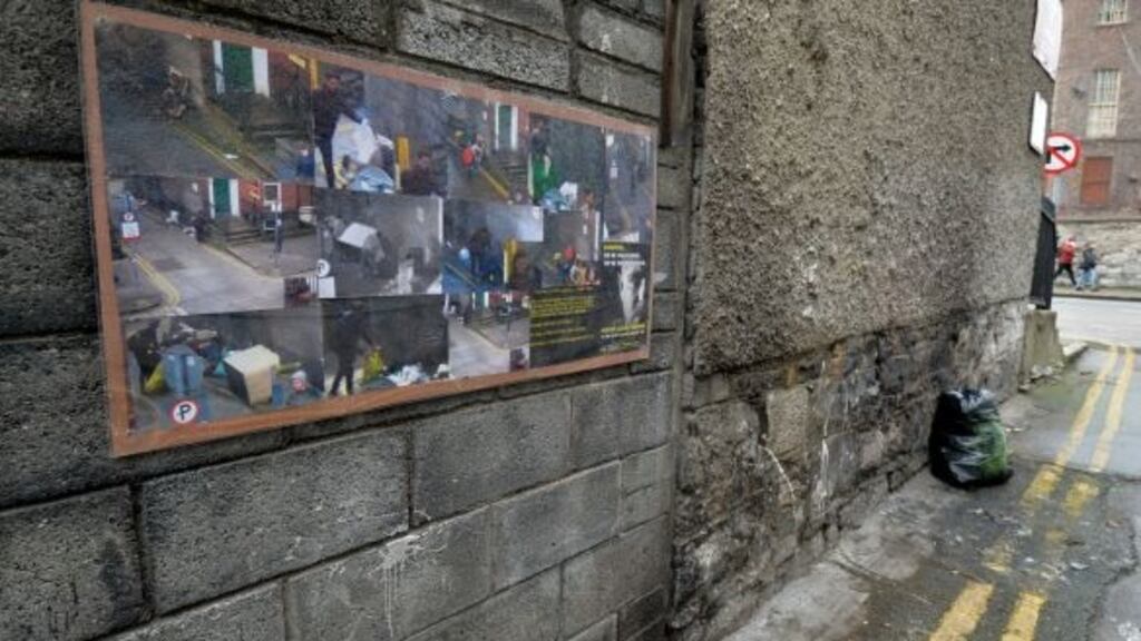 Frankfort Cottages, Killarney Street, where Dublin City Council has displayed a poster with images of people caught dumping litter in the lane. Photograph: Alan Betson/The Irish Times
