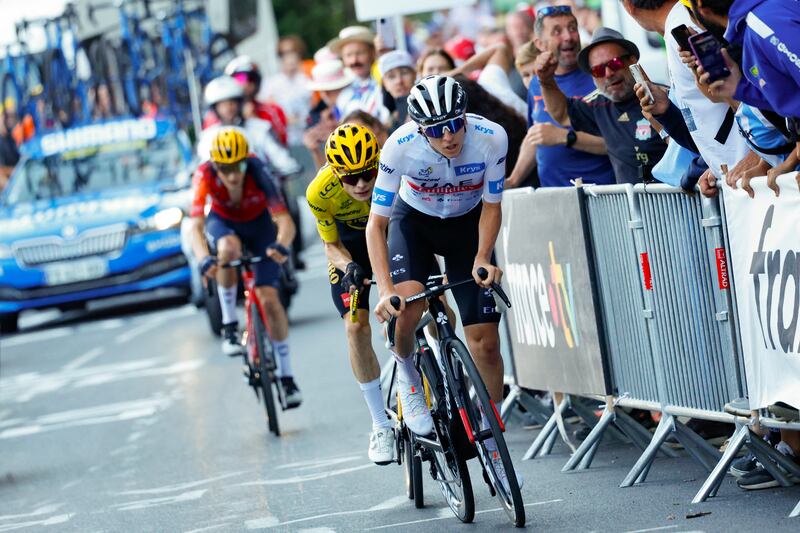 Jonas Vingegaard, wearing the race lleader's yellow jersey, keeps a close watch on Tadej Pogacar on the final ascent of Saint-Gervais-les-Bains on Sunday. Photograph: Etienne Garnier/AFP via Getty Images