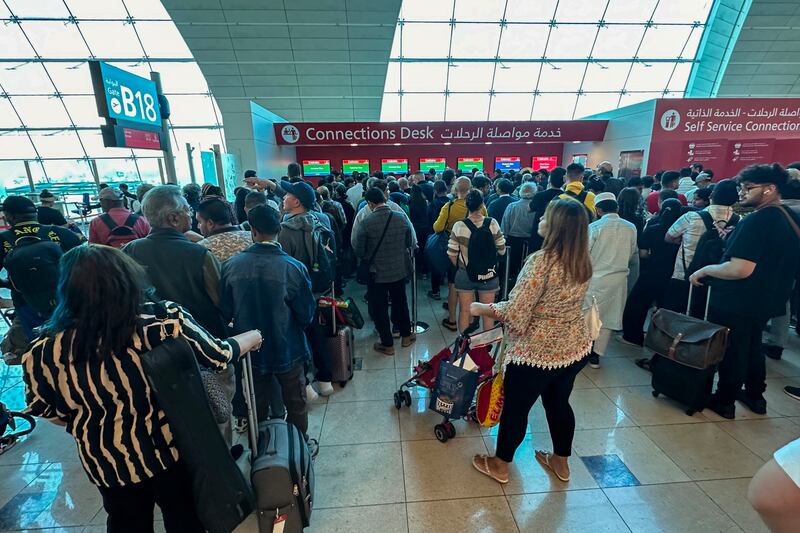 Passengers queue at a flight connection desk at the Dubai International Airport in Dubai as heavy rains lashed the United Arab Emirates. Photograph: AFP via Getty Images