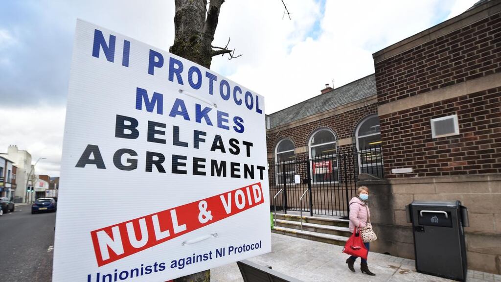 A sign protesting against the Northern Ireland Protocol is seen in Larne town centre. Photograph: Charles McQuillan/Getty Images
