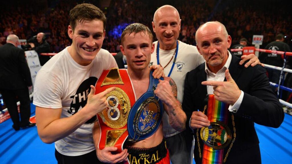 Carl Frampton and his entourage, including manager Barry McGuigan (right), celebrate with his title belts after the fight in Belfast. Photograph: Russell Pritchard/Presseye/Inpho