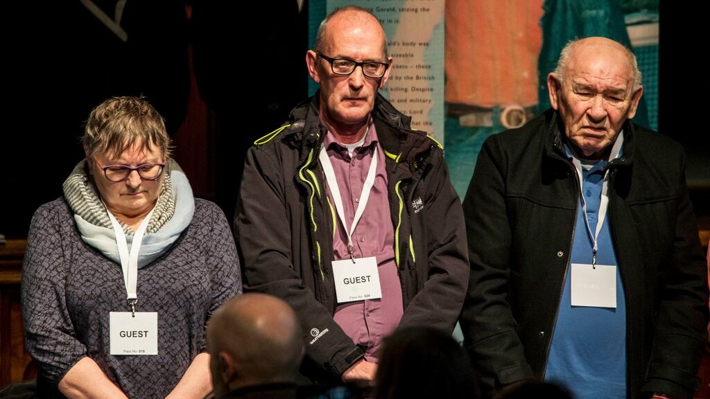 From left: Jean Hegarty, sister of Kevin McElhinney, John Wray, brother of James Wray, and Paddy Nash, brother of William Nash, stand for a minute’s silence with other families of those who were killed, ahead of a press conference inside the Guildhall in Derry. Photograph: Liam McBurney/PA