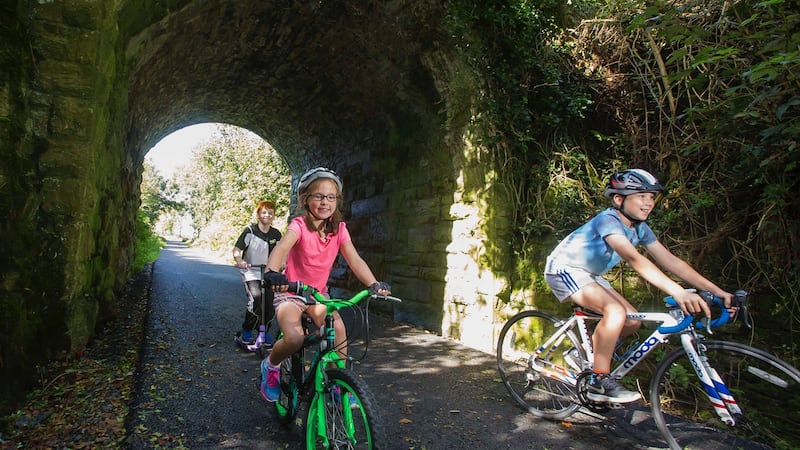 Gráinne and Sean de Paor with Kevin Dwyer on the Waterford Greenway. Photograph: Patrick Browne