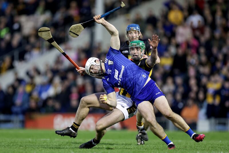 Clare's Aidan McCarthy is tackled by Tommy Walsh of Kilkenny during the NHL final. Photograph: Laszlo Geczo/Inpho