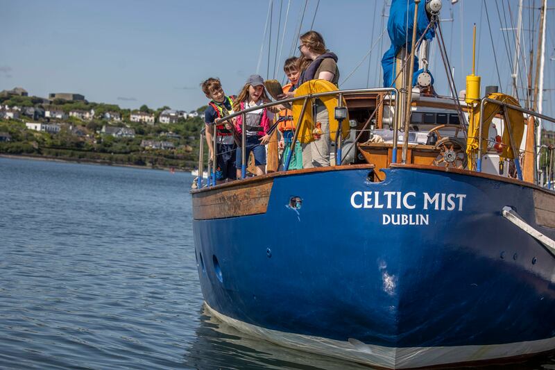Pictured on the Celtic Mist are Rohan Fleury, Alissa Fleury and Eamon Whitty speaking with Sibéal Regan, education and outreach officer, Irish Whale and Dolphin Group. Photograph: Clare Keogh