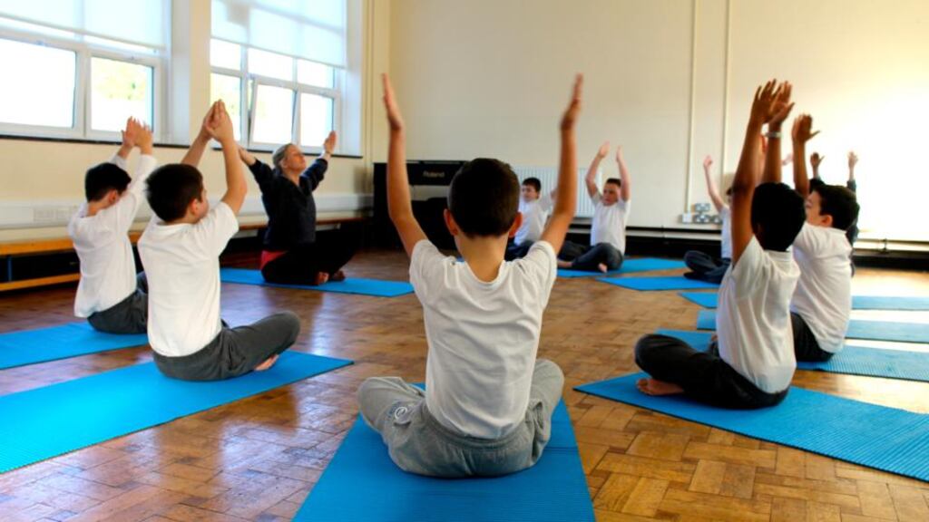 Students at Francis St CBS boys primary school in the Liberties, Dublin, take part in a yoga class. Photograph: Ashoka Ireland