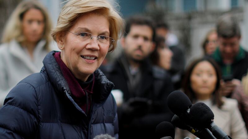 Elizabeth Warren after announcing she has formed an exploratory committee to run for president in 2020, outside her home in Cambridge, Massachusetts, on Monday. Photograph: Brian Snyder/Reuters